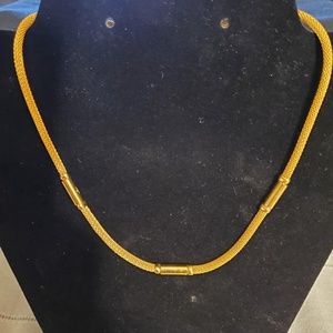 Gold colored rope style necklace, approx 7"